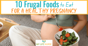 torso of a pregnant woman sitting on the floor while eating a salad