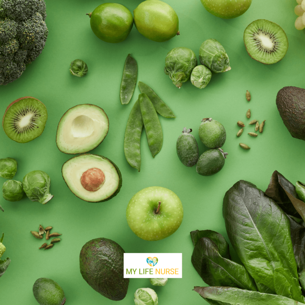 green vegetables on a green background. sugar snap peas, avocado, lettuce, Brussels sprouts 