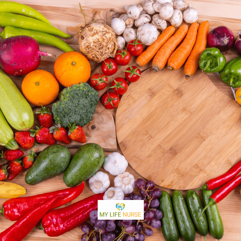 A cutting board displays a variety of freshly chopped vegetables, including broccoli, carrots, red bell peppers, cherry tomatoes, and cucumber, for a post "How to Try New Vegetables When You Hate to Eat Veggies."