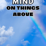 blue sky, puffy white clouds and a rainbow