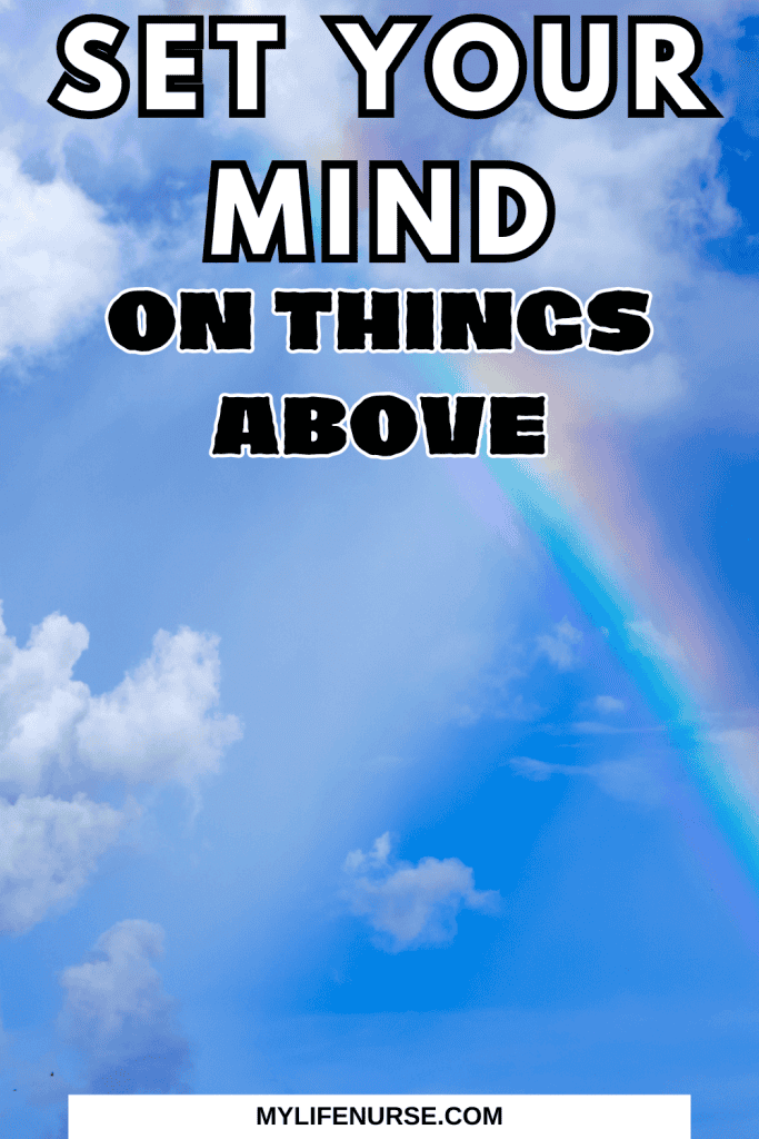 blue sky, puffy white clouds and a rainbow