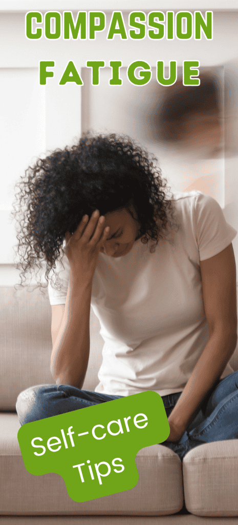 stressed woman sitting on couch with head bent over in her hand.