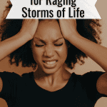 stressed woman holding her temples and grimacing.