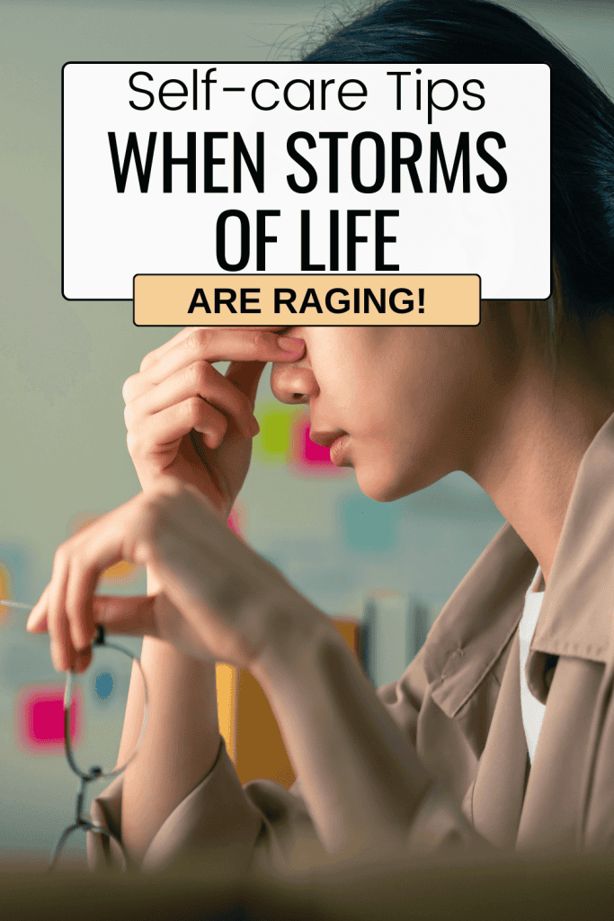 profile of stressed woman holding her glasses in left hand while putting pressure on her head by holding onto the top of her nose