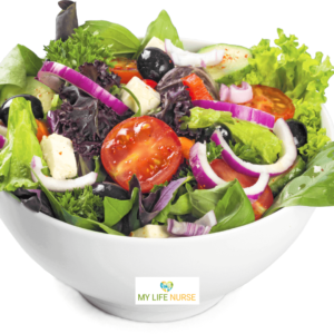 A bowl of mixed salad featuring leafy greens, tomatoes, cucumbers, olives, onion, and cheese, illustrating how to love eating vegetables.